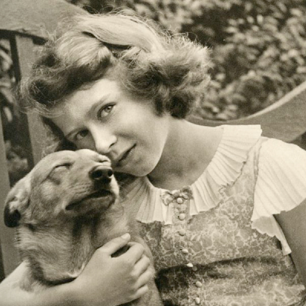 1930s photo of young Queen Elizabeth II with her Welsh Corgi Dookie - AKC Library. #queenelizabethphotos