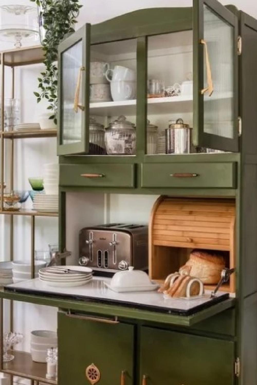 Bancha (Farrow & Ball) paint color on a kitchen cupboard with toaster - @victoriaaldersonart. #bancha #greenpaintcolors