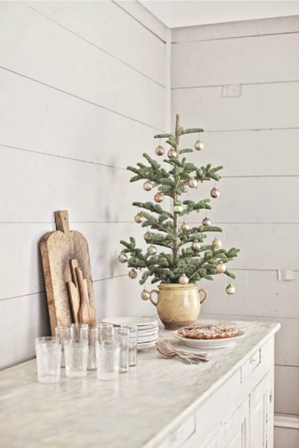 Dreamy Whites French farmhouse Christmas tree in antique jar on maarble counter. #frenchchristmas #frenchfarmhouse #vintagechristmas