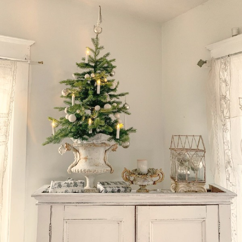 Nordic French Christmas style with Christmas tree in vintage urn and white decorations - My Petite Maison. #swedishchristmas #christmasdecor #frenchchristmas #nordicfrench