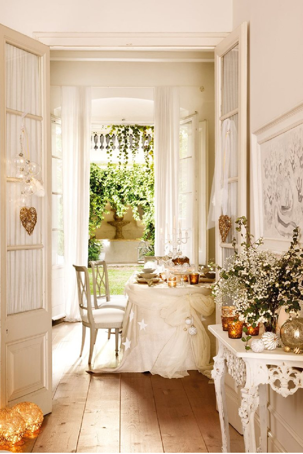 White country French decorated 1864 home on the Maresme Coast of Spain is decorated in whites for Christmas. #christmasdecor #housetour #whitechristmas #romanticchristmas #frenchcountry #frenchchristmas #whitedecor