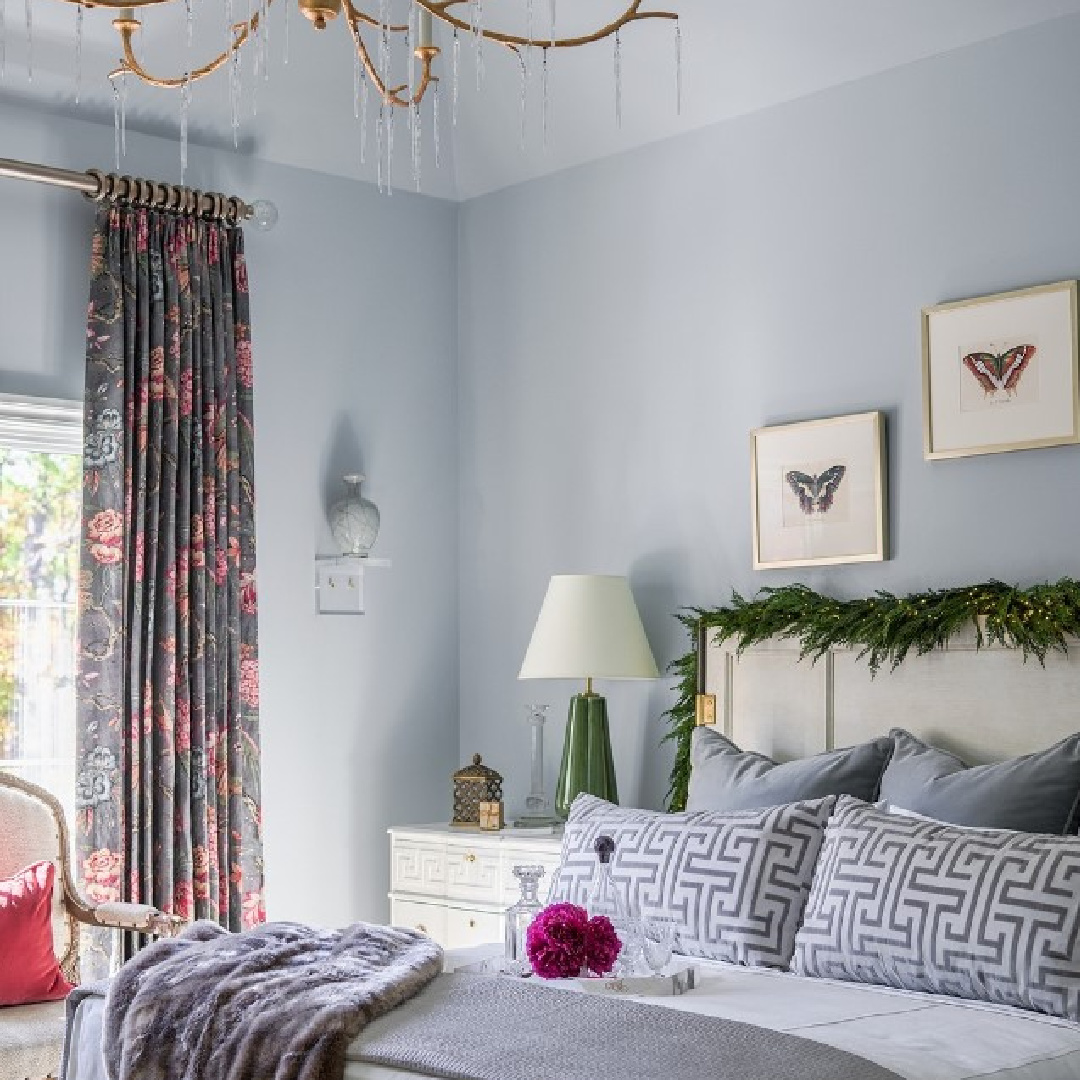 Christmas garland on headboard in a blue bedroom in Atlanta Holiday Home - design by Valerie Garrett Interiors. #atlantaholidayhome #bluebedrooms