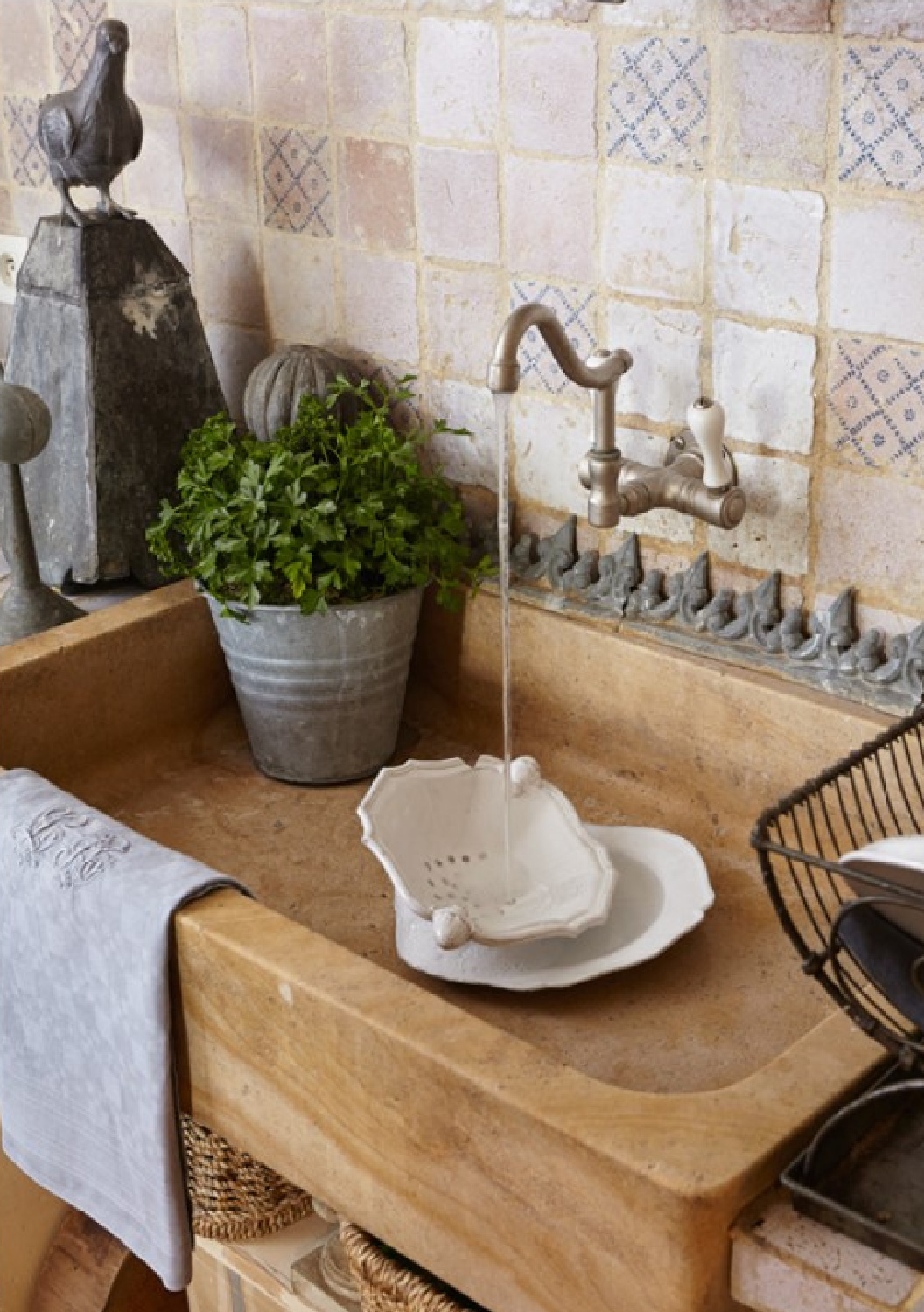 French country sink and handmade tile backsplash in Old World kitchen of Sophie Lambert, owner of Autempsdescerises. #frenchcountry #frenchkitchen #oldworldstyle