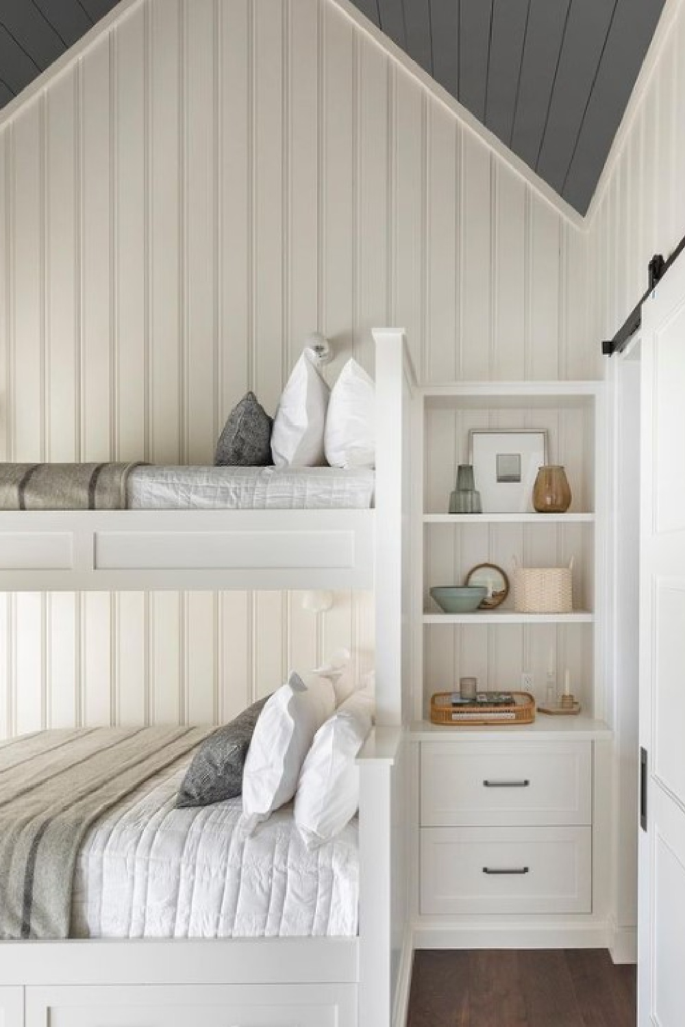 Beautiful custom bunk beds, bead board walls, and a deep blue ceiling - design by Marie Flanigan. Photo by Julie Soefer.