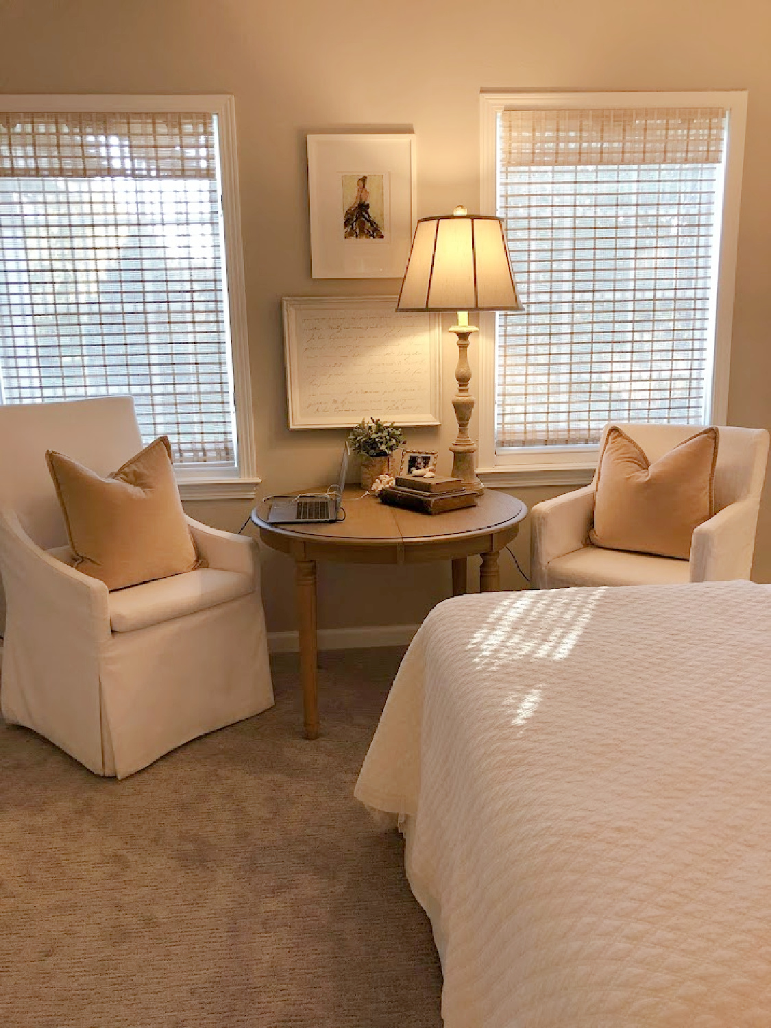 A serene bedroom with art from Holly Irwin - Hello Lovely Studio.