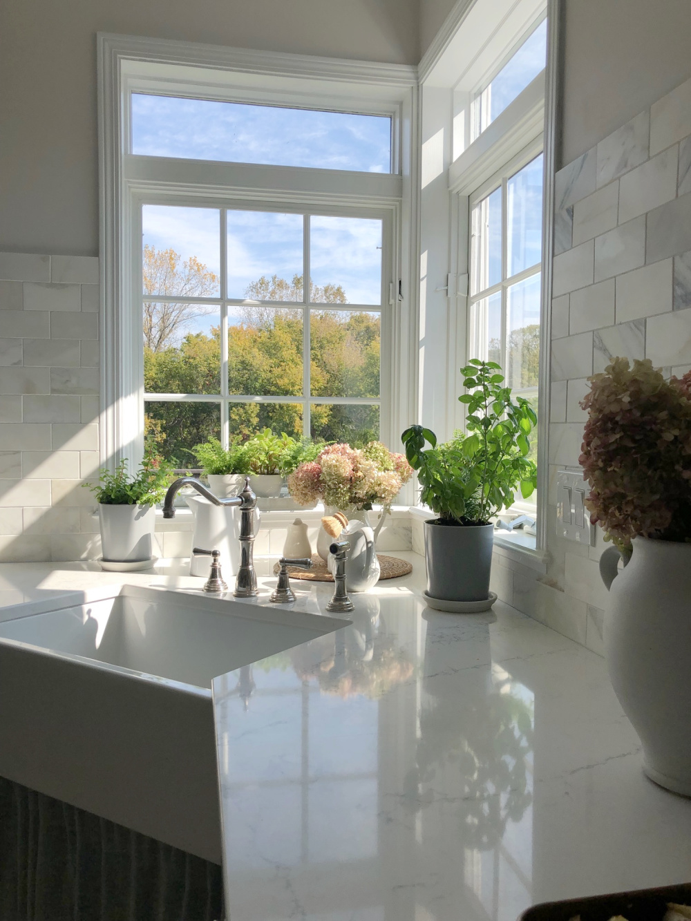 Farm sink and Viatera Muse quartz countertops in our modern French kitchen - Hello Lovely Studio.