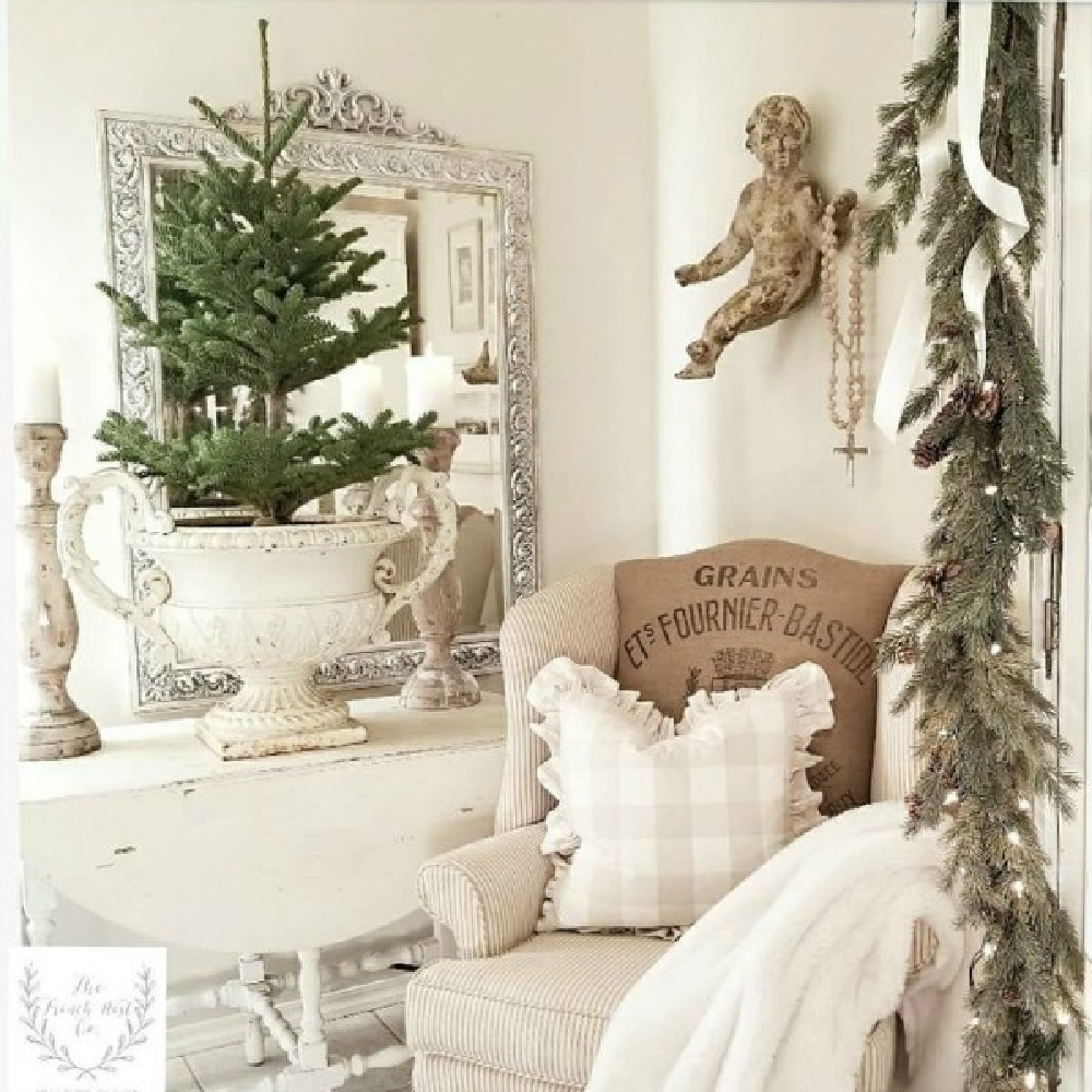 French country Christmas decor inspiration with cherub and tree in urn - The French Nest Co Interior Design. #frenchcountrychristmas