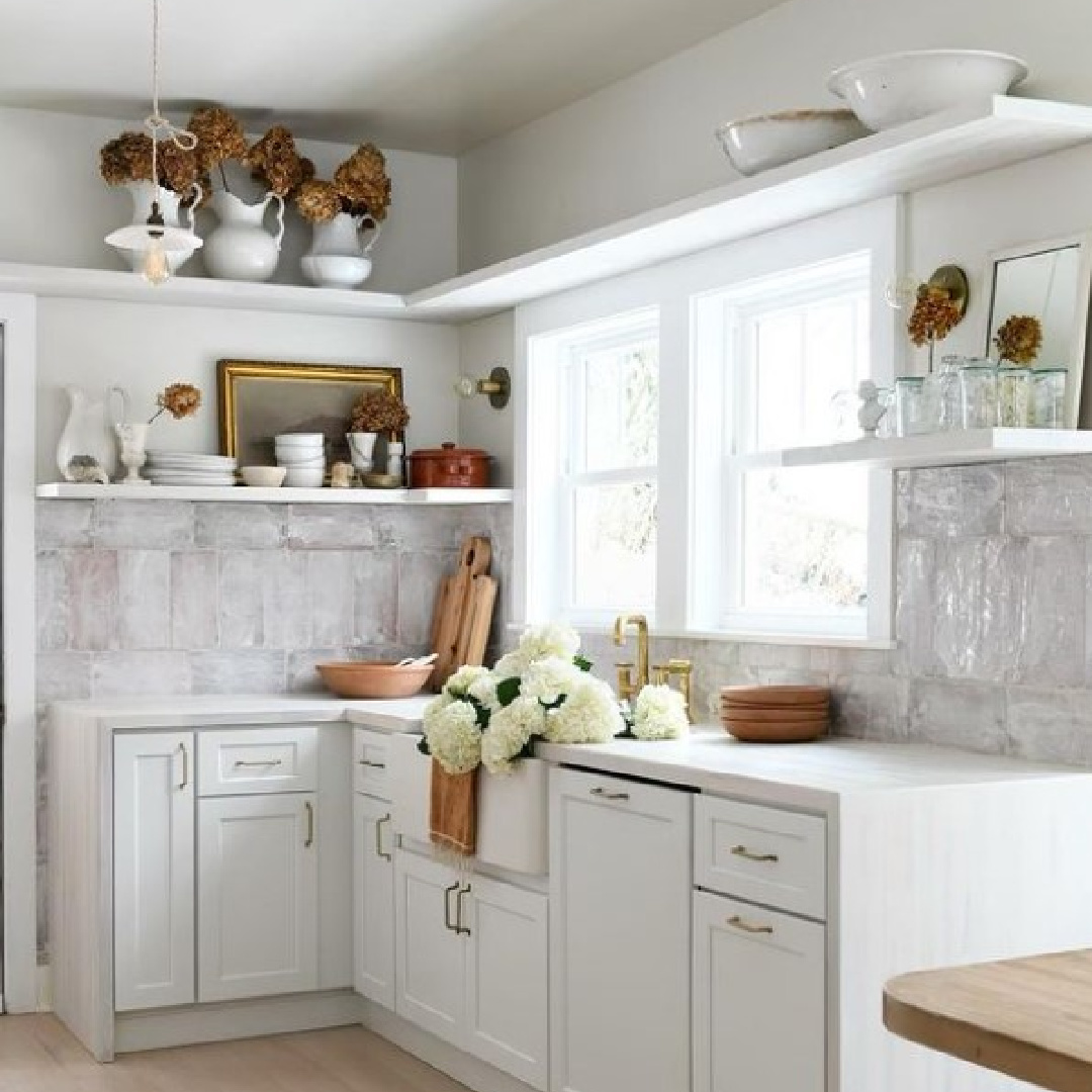 Leanne Ford designed rustic modern kitchen with white shelves, farm sink, and customized tile backsplash. #leanneford #modernrustic