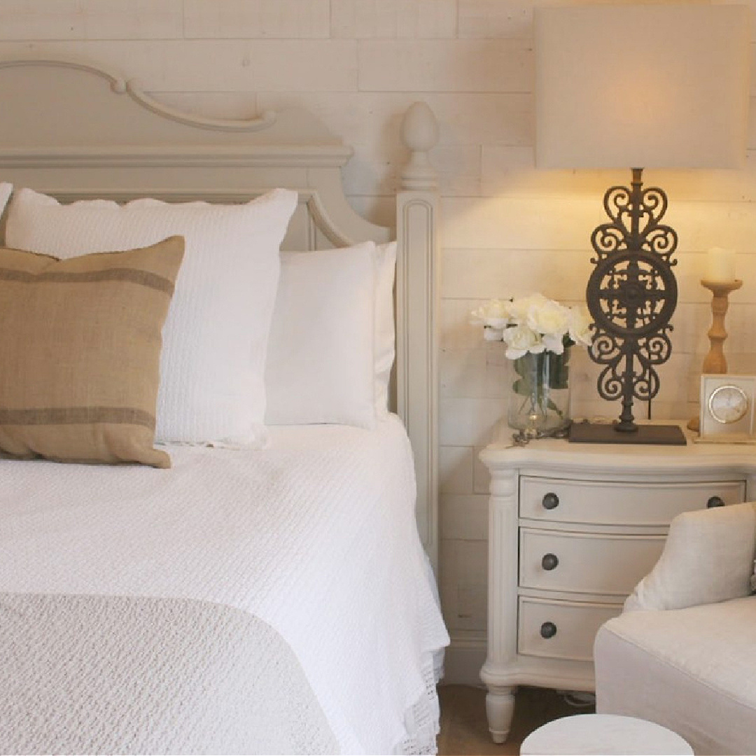 Neutral, serene, European country bedroom with Stikwood accent wall (Hamptons), white bedding, and BM Revere Pewter painted furniture - Hello Lovely Studio. #reverepewter #cottagebedroom