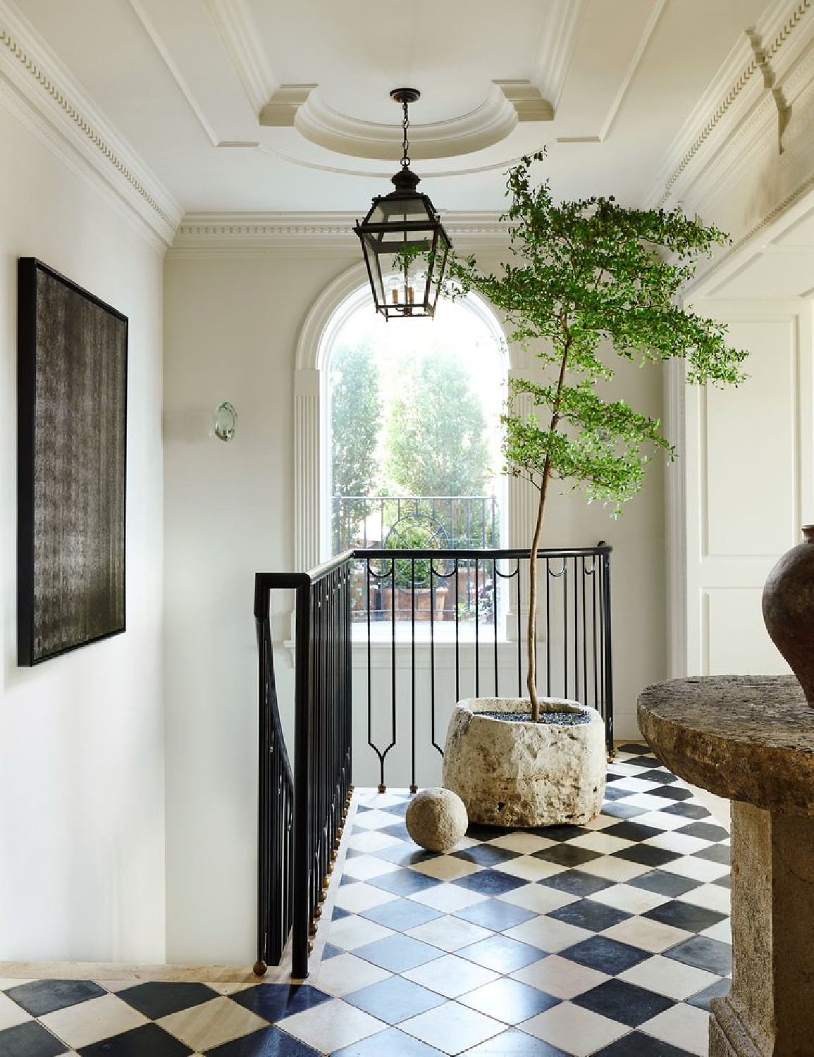 Entry with checkered floor and black railing in Nate Berkus & Jeremiah Brent Manhattan townhouse with 1920s architecture, neutral palette, plaster paint, and marble. AD (photo: Kelly Marshall). #nateberkus #nytownhouse