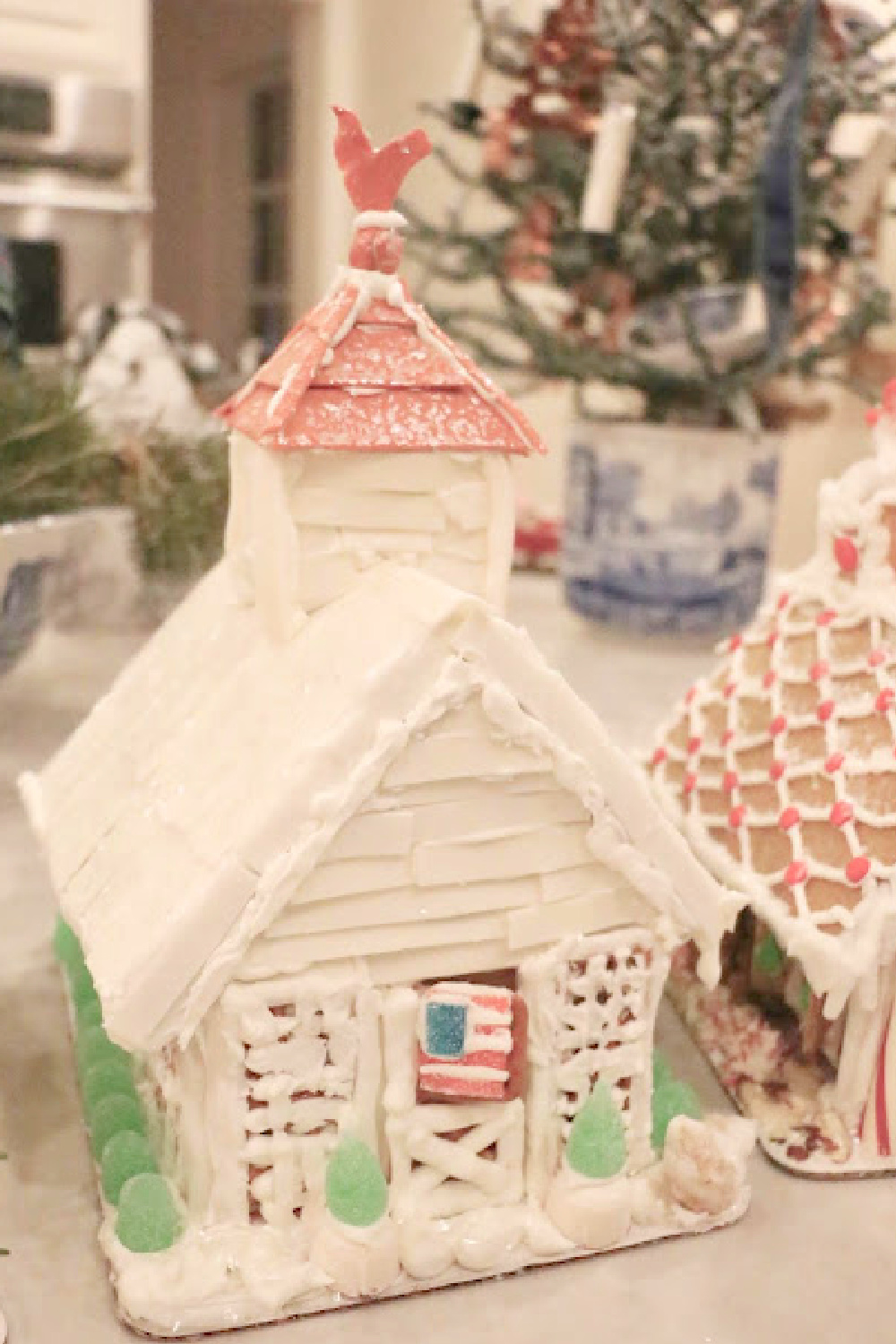 Charming white gingerbread house chicken coop with cupola (Big Red gum copper roof) and American flag - Eleven Gables. #gingerbreadhouse #christmasdiy #holidaybaking