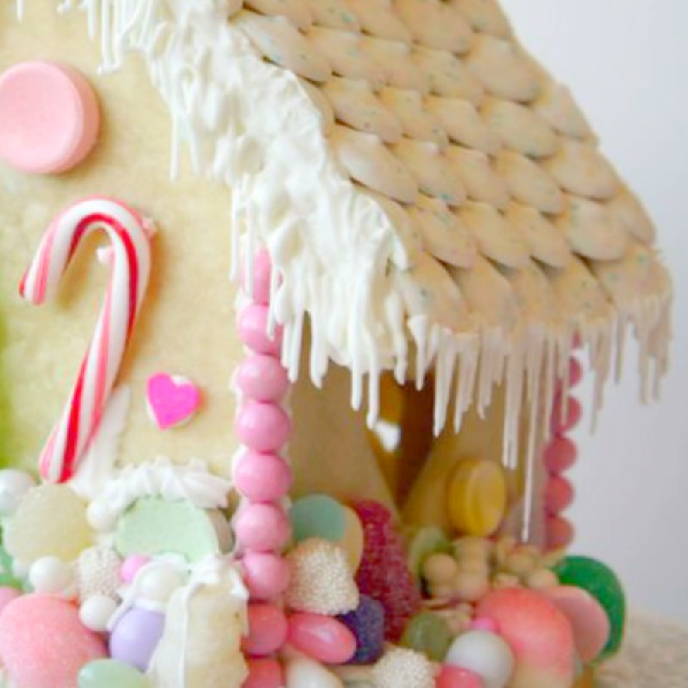 Fanciful gingerbread house made from sugar cookie dough and colorful candies.