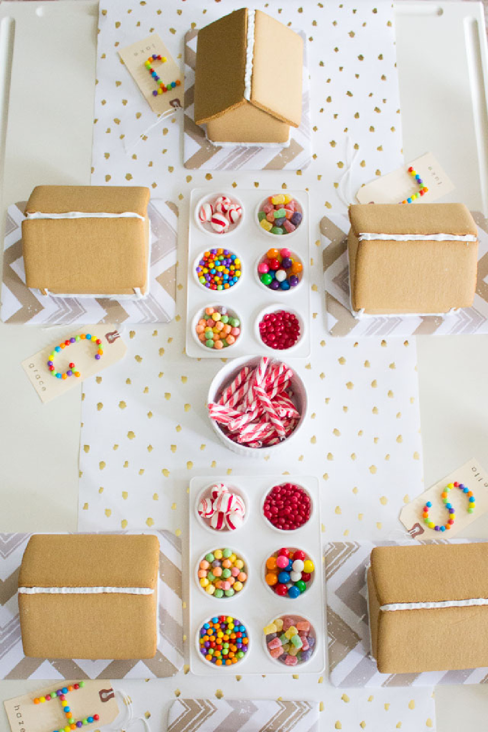 Gingerbread house making party ingredients and tablescape.