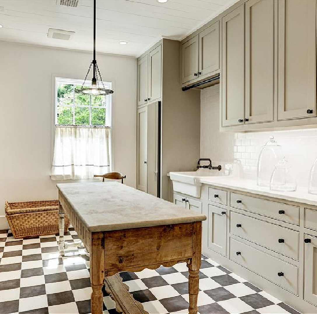 Checkered floor in laundry room of Milieu Showhouse 2020 in Houston - a beautiful modern French country style space with neutrals and a whimsical pattern. #checkeredfloors