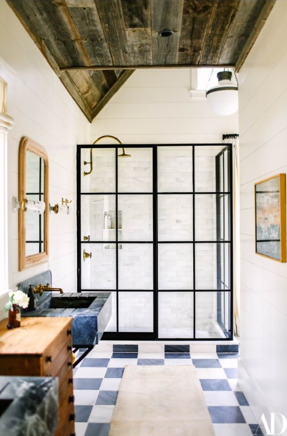 Brooklyn Decker's bathroom with black and white checkered floor, black sink, and marble subway tile shower. #checkeredfloor