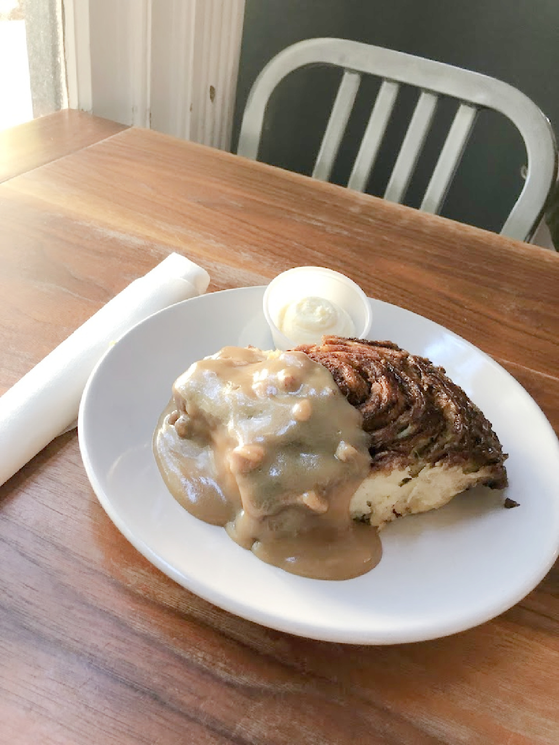 Franklin, TN Biscuit Love's The B-Roll - a biscuit cinnamon roll with pecan sticky bun sauce and cream cheese icing.