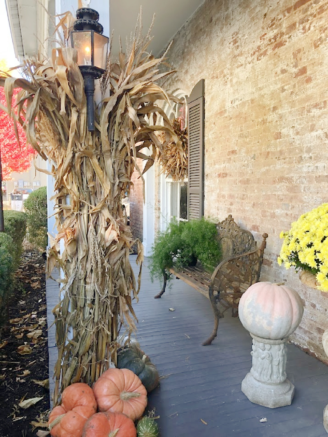 Fall decor on porch at Knight Mosley House 1815 which is home to City Farmhouse in Franklin, TN.