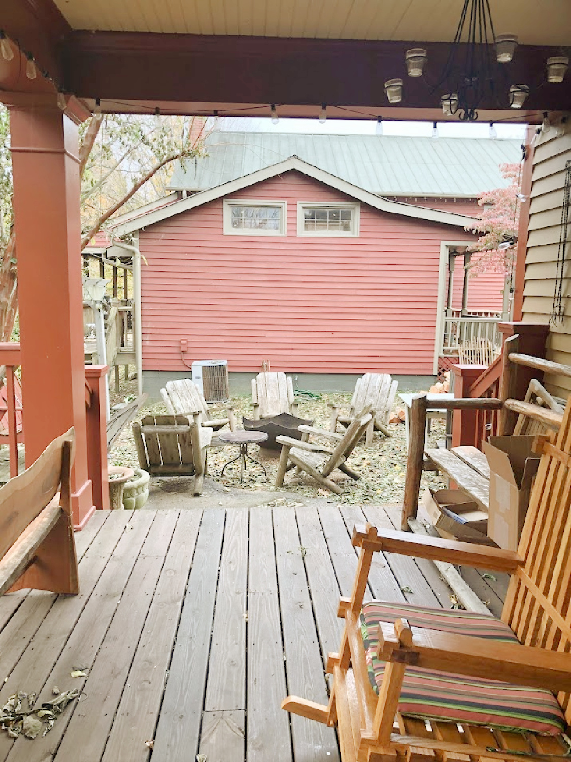 Back porch and nearby firepit overlooking creek at Creekside Trading in Leiper's Fork, TN - Hello Lovely Studio.