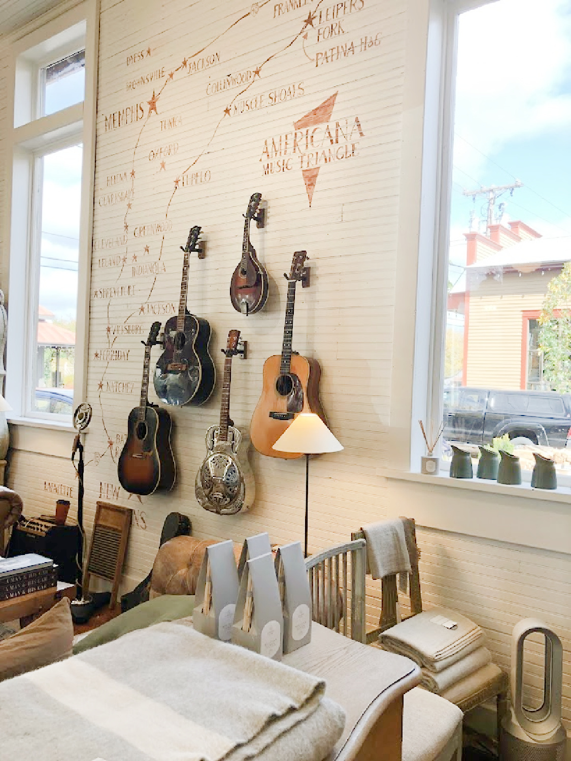 Guitars on wall inside Patina Home & Garden shop from Giannettis in Leiper's Fork, TN - Hello Lovely Studio. #patinahome #leipersforktn