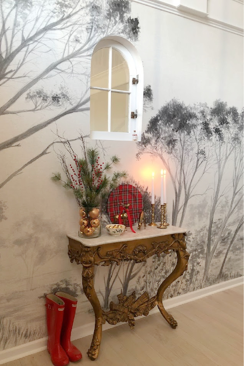 Tree wallpaper mural and French console table decorated for holidays in our Georgian home's entry - Hello Lovely Studio.
