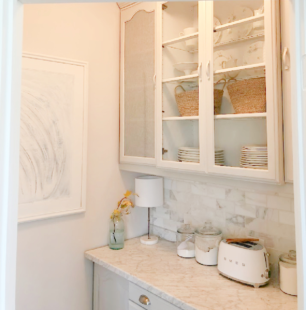 Renovated pantry with light grey cabinets (50% Farrow and Ball Pavilion Gray) and calacatta gold marble backsplash - Hello Lovely Studio.