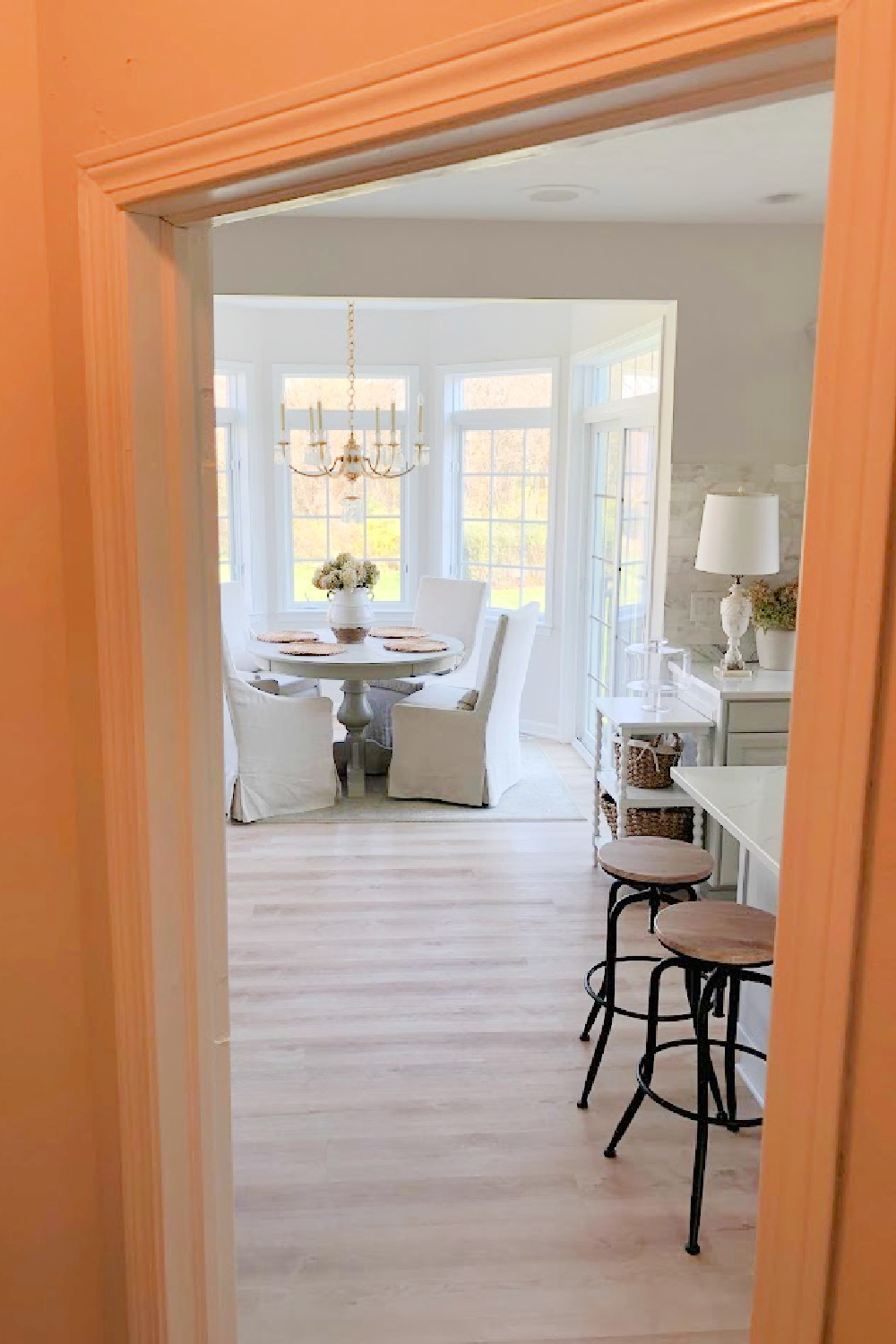 Renovated kitchen with Viatera Muse countertops and Sherwin Williams Eider White paint color. Cabinets are 50% Farrow & Ball Pavilion Gray - Hello Lovely Studio.