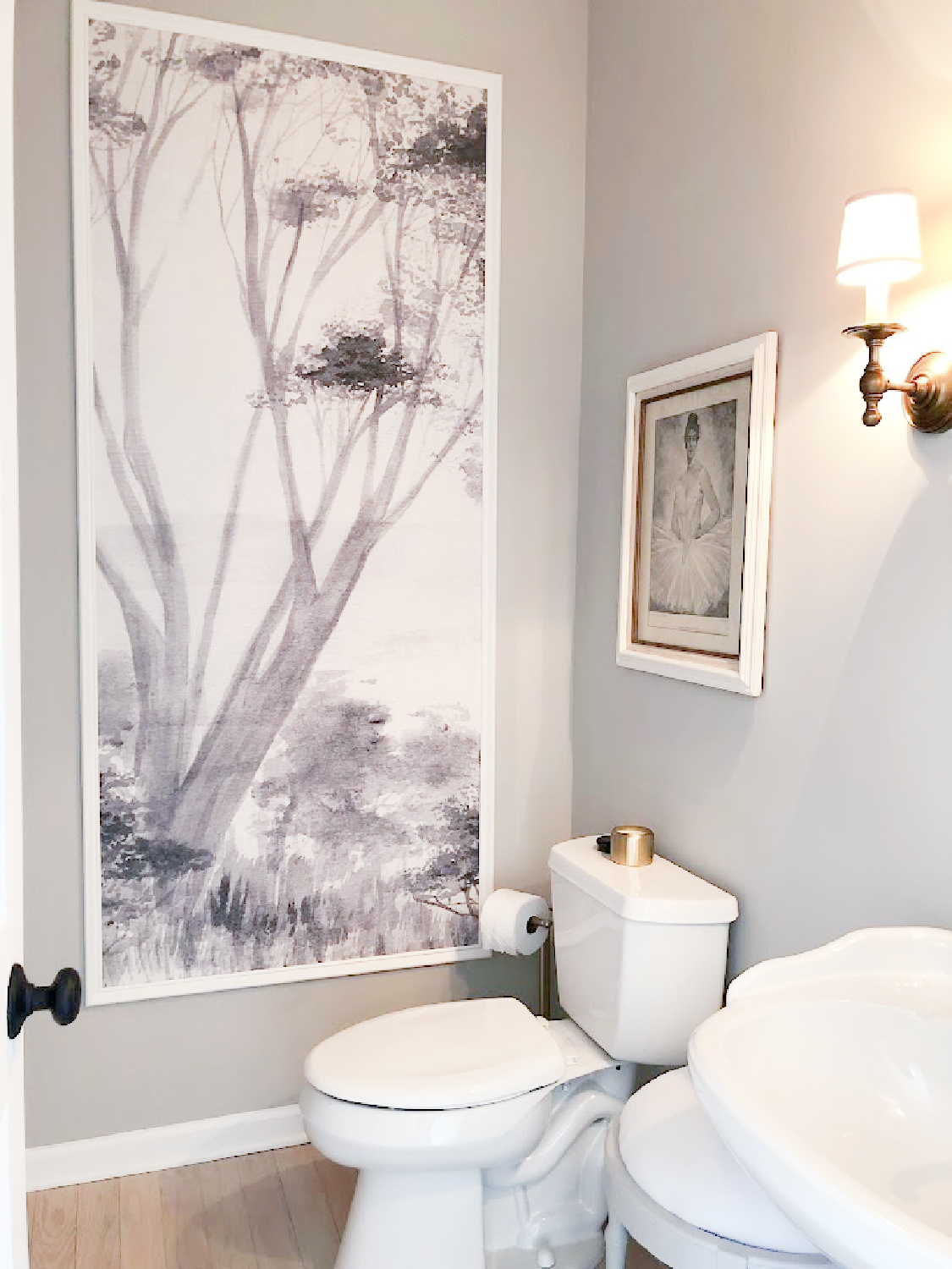 Silvery grey paint color in powder bath (Repose Gray) with framed Photowall Sweden tree mural greige wallpaper - Hello Lovely. #reposegray