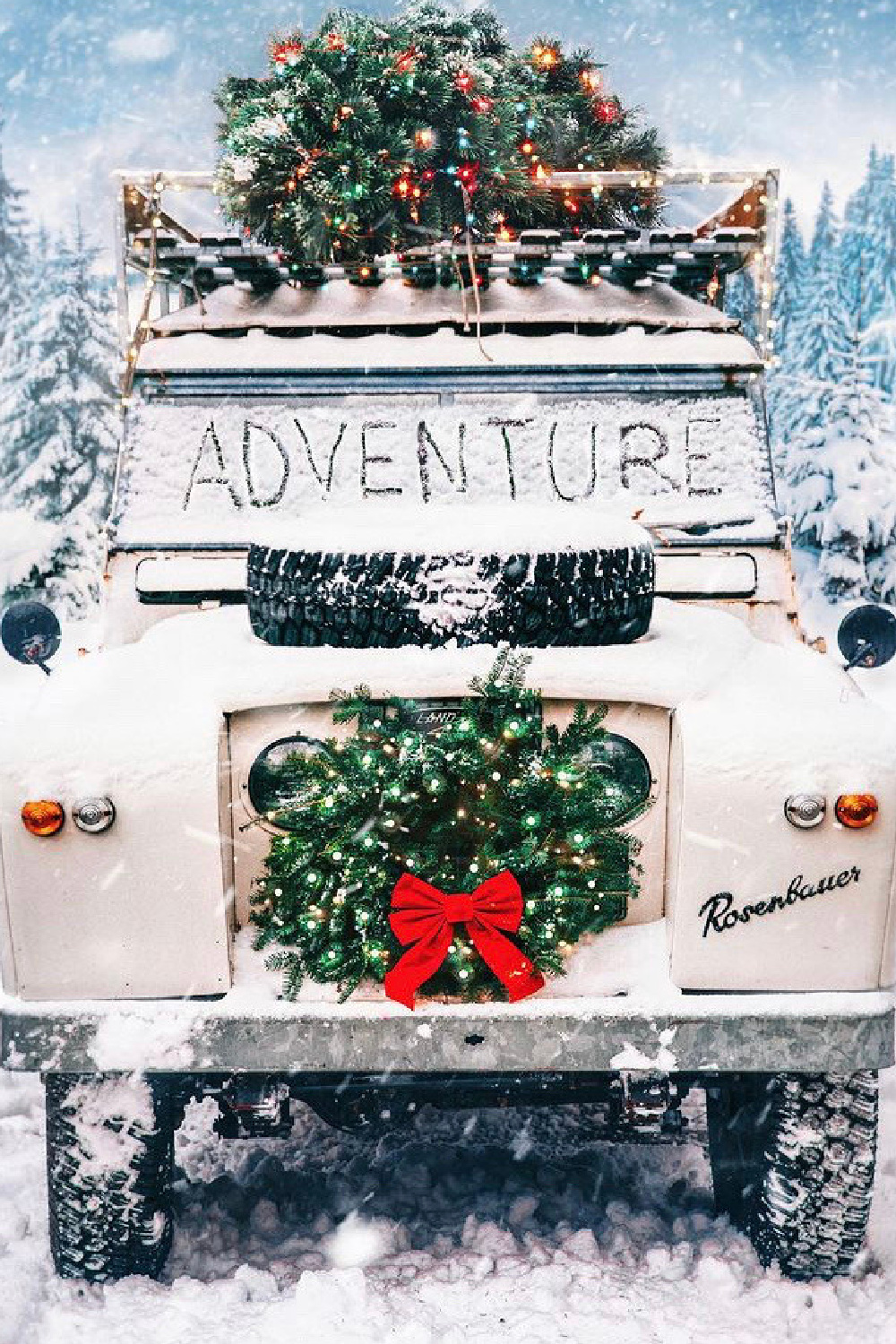 Charming SUV decorated for Christmas with wreath in snowy woods - @tildeathdousart. #christmascozy #christmascar #christmasroadtrip