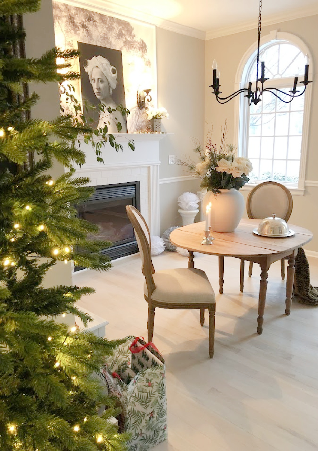 Our renovated dining room turned music room at the Georgian has arched windows, light greyed oak floors, and European country style - Hello Lovely Studio.