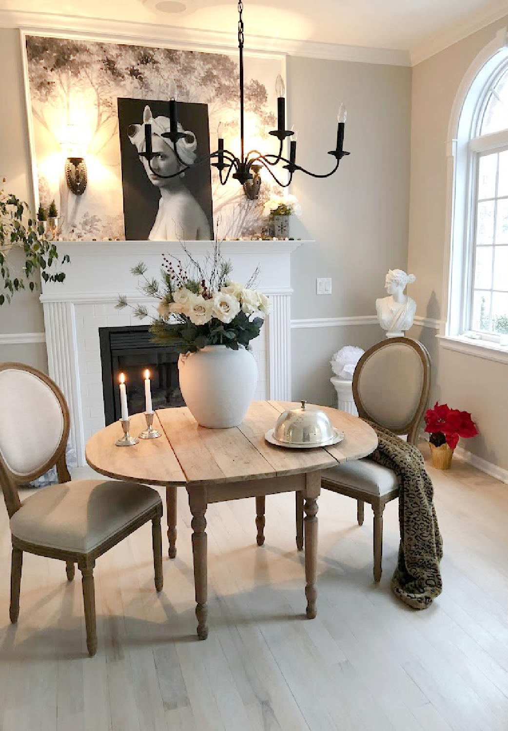 Our renovated dining room turned music room at the Georgian has arched windows, light greyed oak floors, and European country style - Hello Lovely Studio.