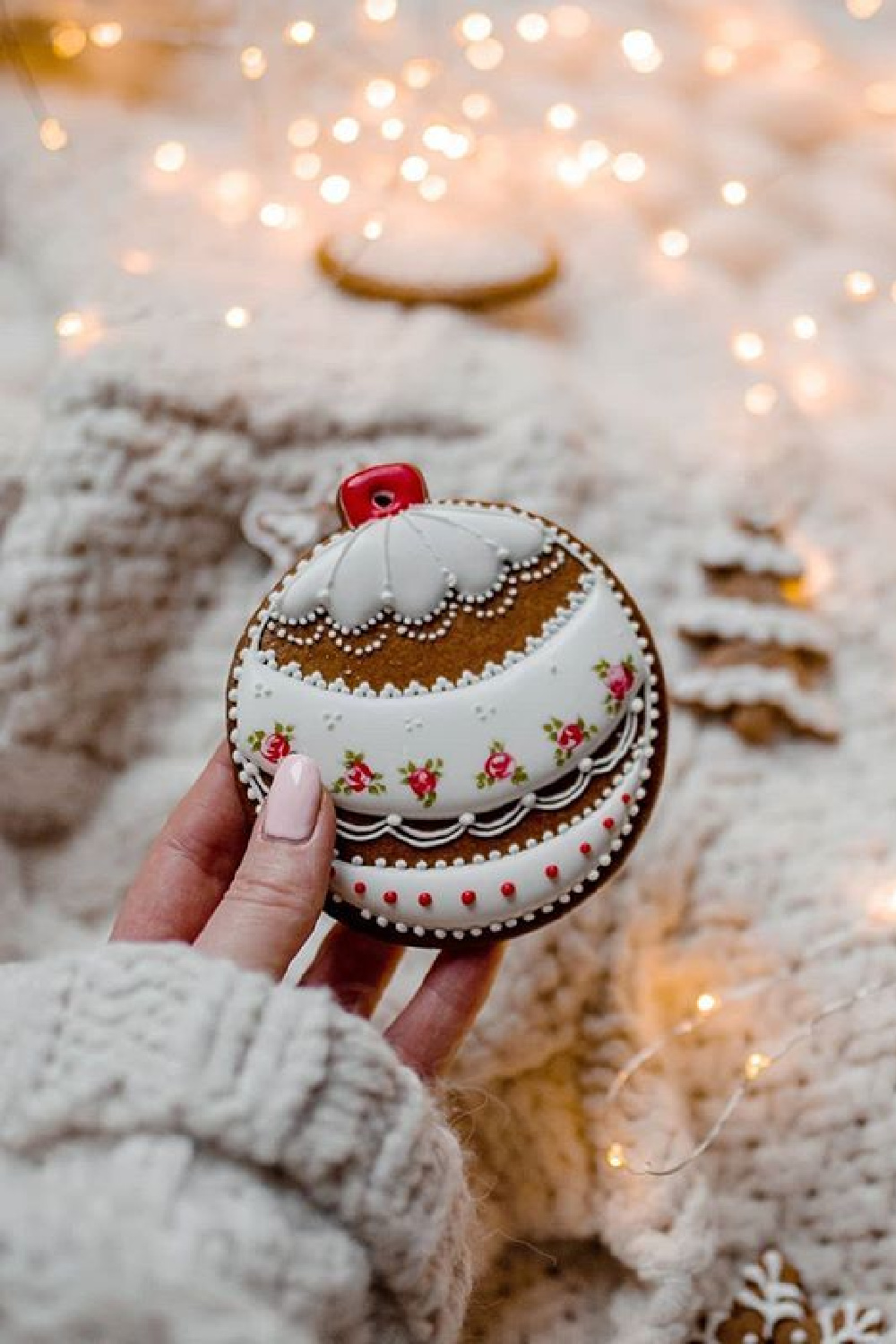 Beautifully decorated Christmas ornament cookie and snowy ground - @annamichaliszyn. #christmascookies