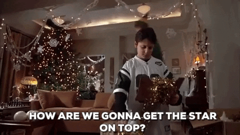 gif result for silly Christmas gifs Elf Will Ferrell Buddy star on top of tree