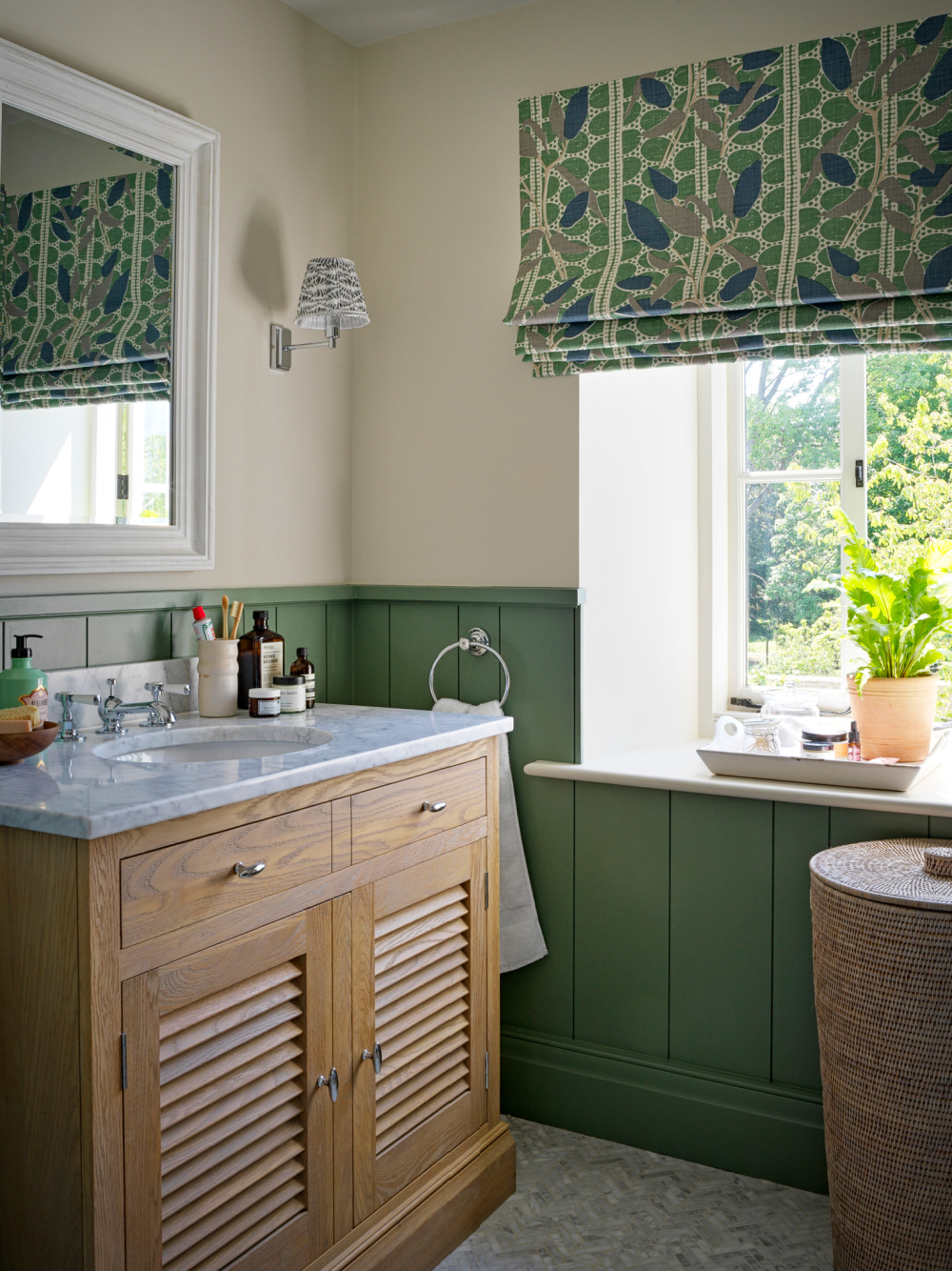 English Country bathroom interior with green and design by Sims Hilditch in THE EVOLUTION OF HOME (Rizzoli, 2022).