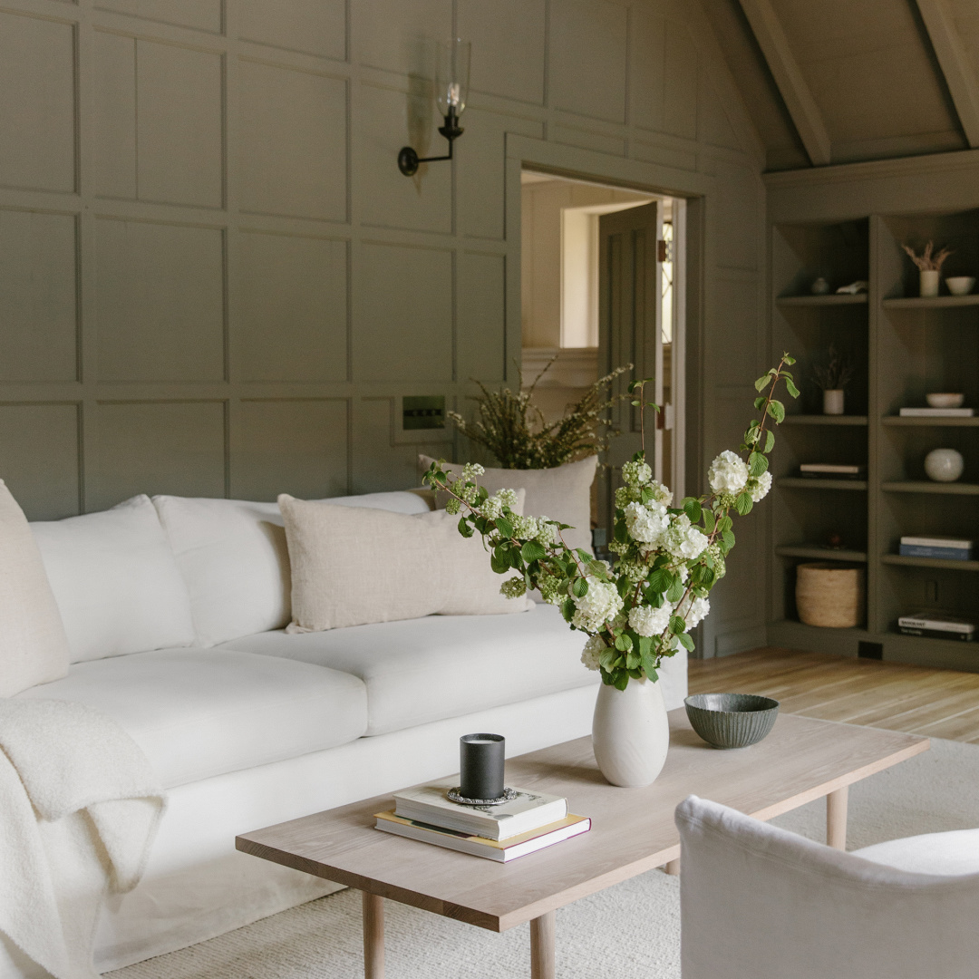 Deep earthy green walls in a gorgeous rustic modern luxe living room in Jenni Kayne's Canyon Chateau project. #jennikaynehome #greeninteriors