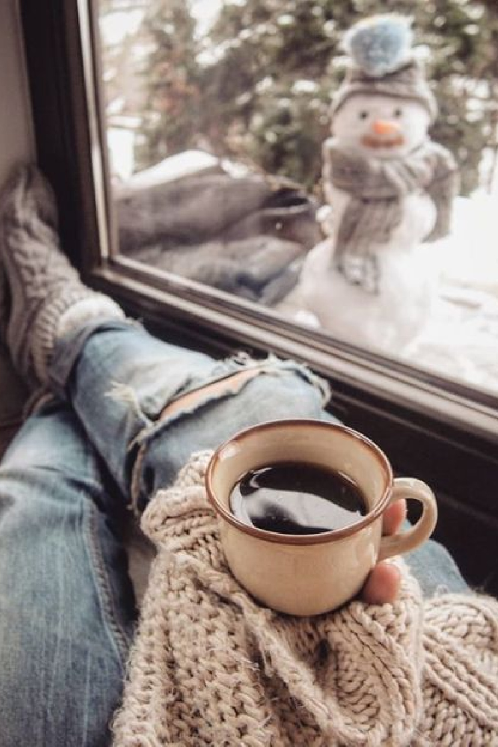 Snowman outside of window with cozy coffee held in hand - @marzena.marideko. #cozychristmas #winterwonder