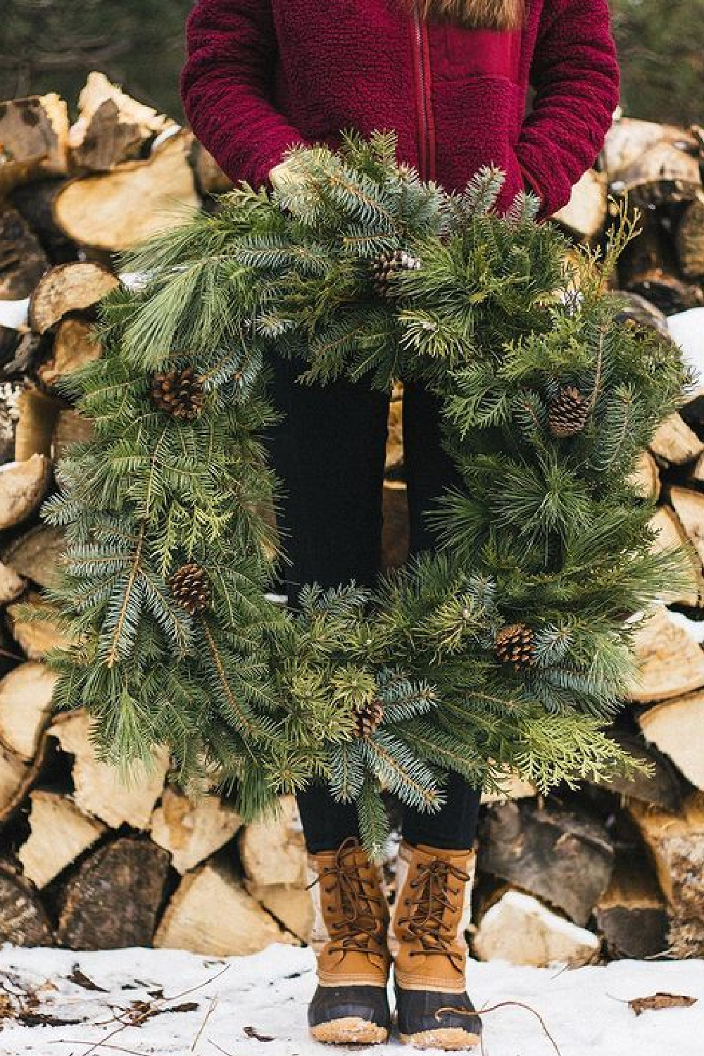 Holiday wreath with firewood and red sweater - @missnortherner. #christmaswreaths
