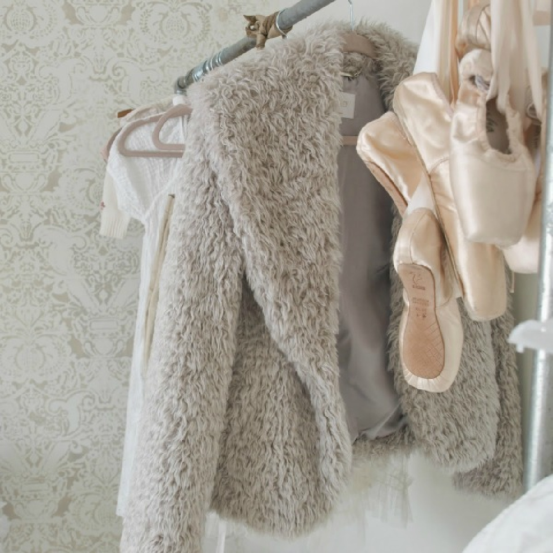 Pink pointe shoes hanging from ribbons on garment rack in my Fortuny stenciled closet - Hello Lovely Studio. #pointeshoes #pinkballetslippers