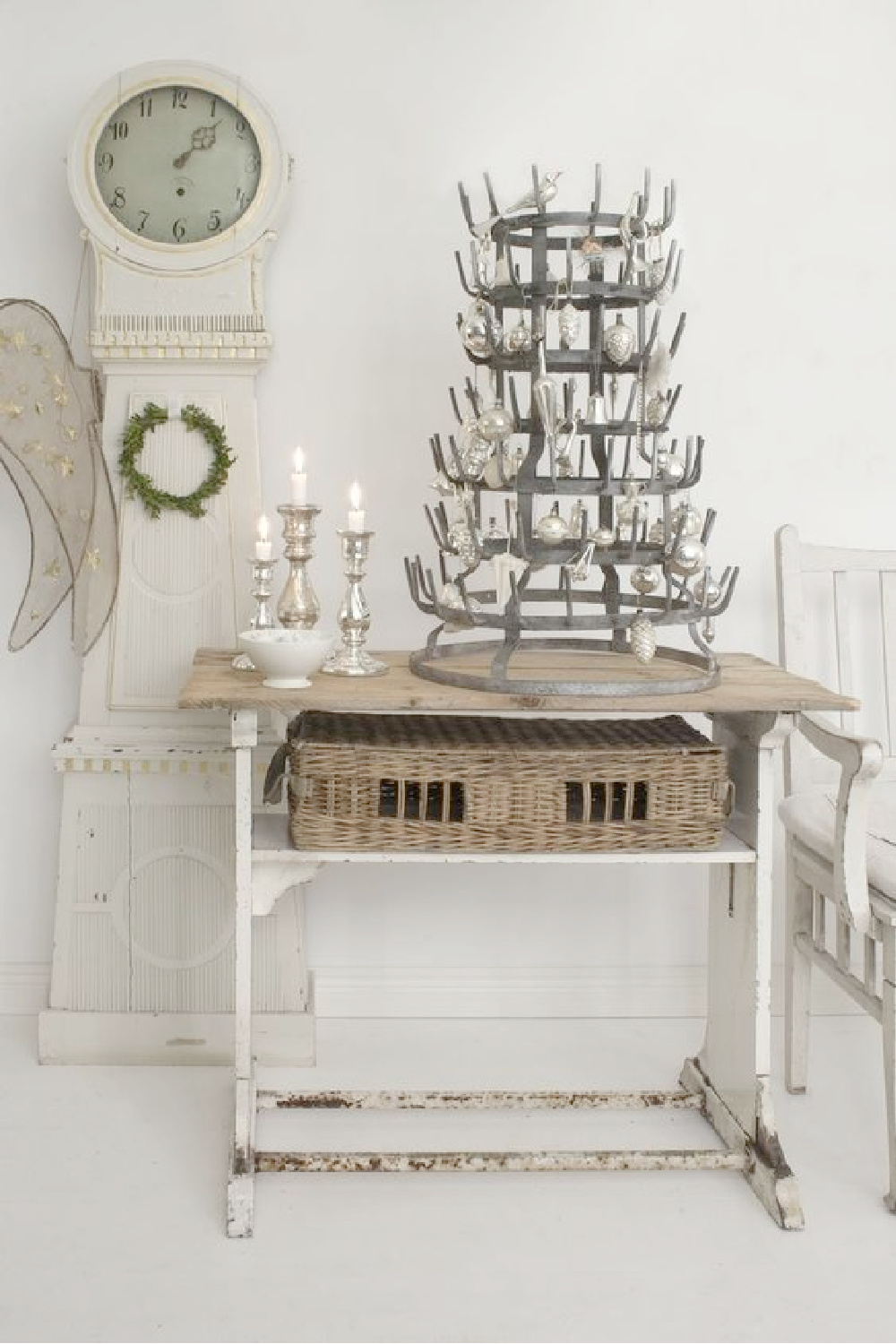 Swedish Christmas and Scandinavian holiday decor idea with vintage bottle rack as Christmas tree with sweet ornaments. The mora clock in foreground is a gorgeous touch! #swedishchristmas #bottlerack #christmasdecor