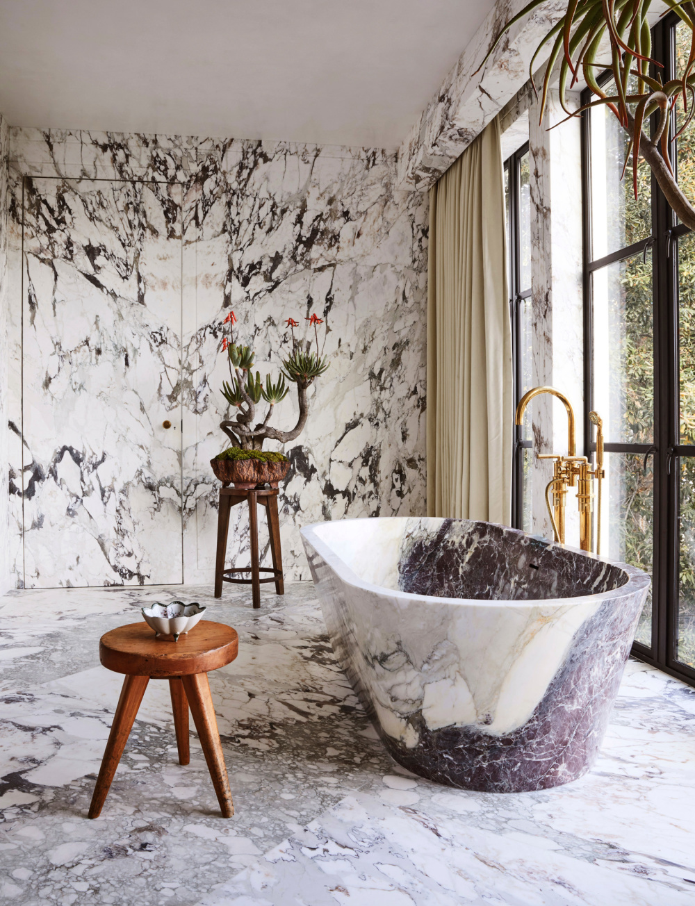 Luxurious fantasy bath with stone soaking tub and marble - in THE ULTIMATE BATH by Barbara Sallick (Rizzoli, 2022).