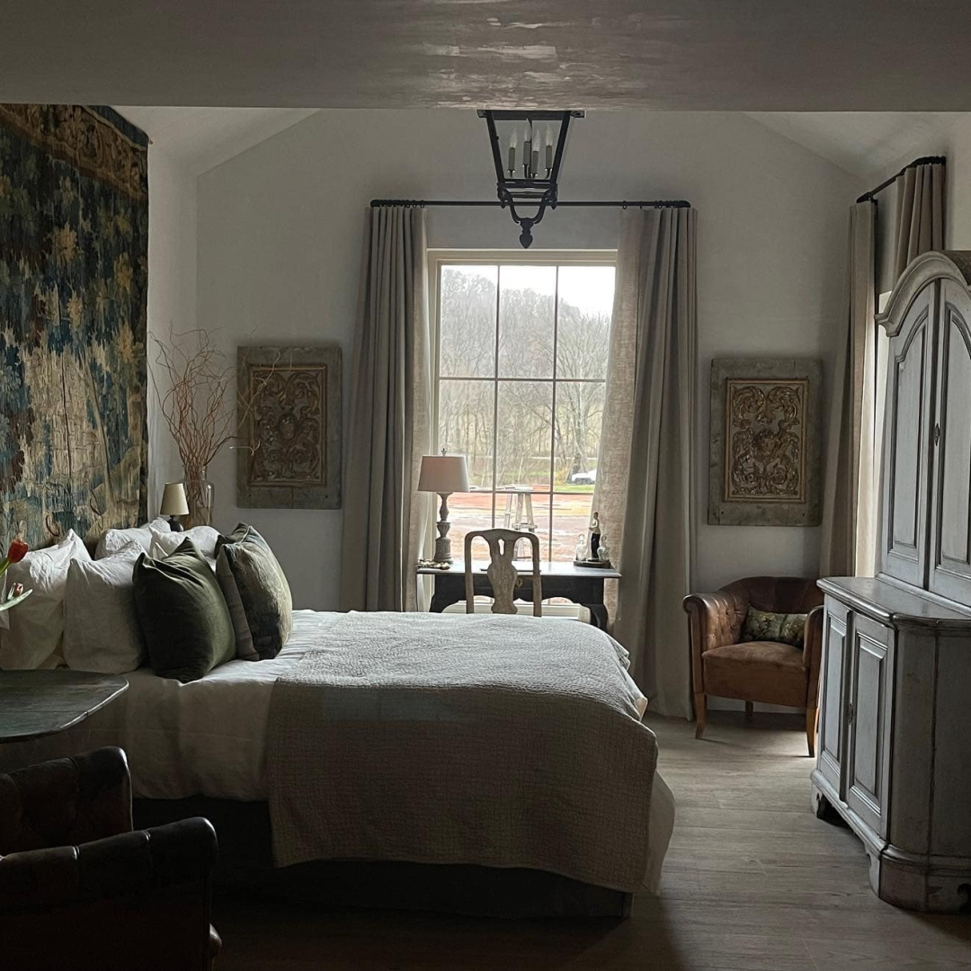 Patina Meadow log cabin bedroom of Brooke Giannetti - European country antiques, patina style, and sumptuous bedding. #patinameadow #patinahomeandgarden #tennesseecottage #logcabins #leipersforktn