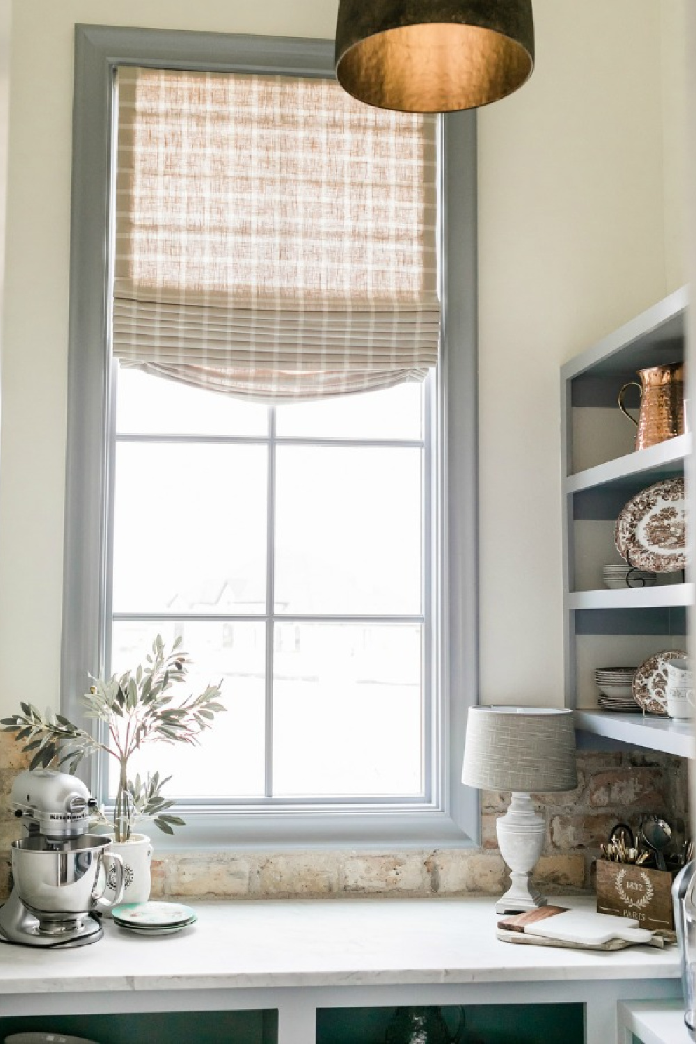 French country butler pantry, coffee room, or scullery with trim and shelves painted Sherwin Williams Uncertain Gray. Brit Jones Design.