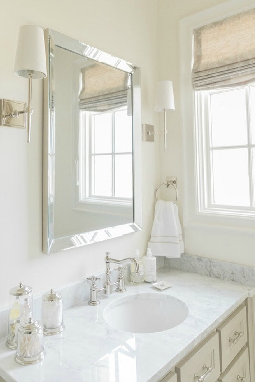 French country farmhouse white bathroom. Sherwin Williams Alabaster paint color on walls. Brit Jones Design.