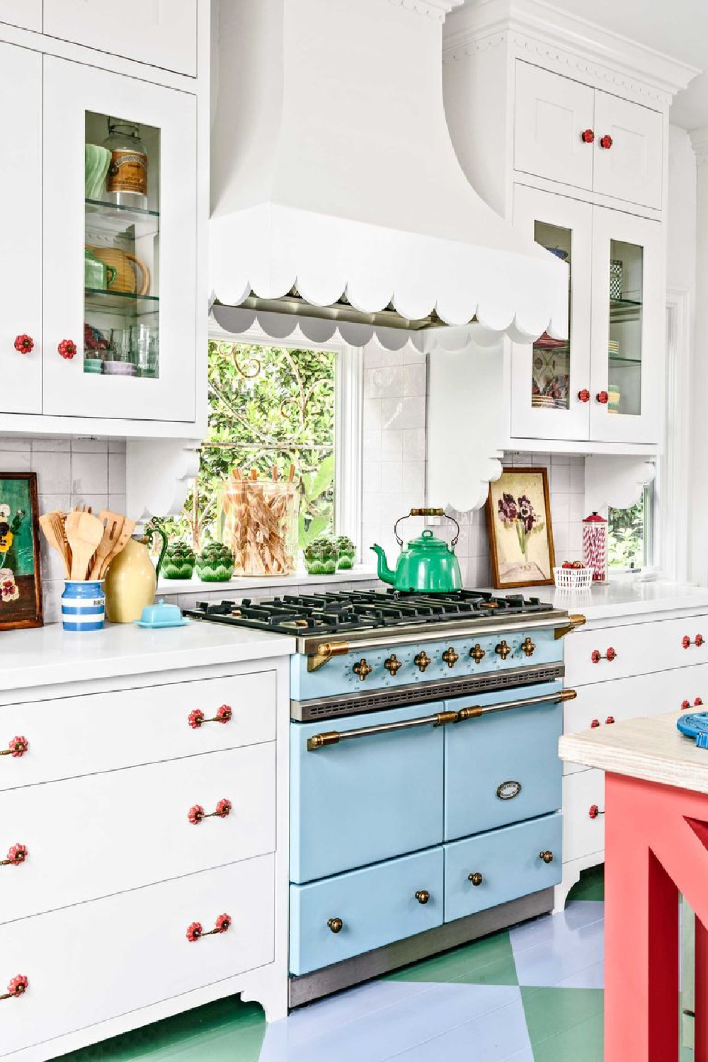 Whimsical scalloped range hood in a kitchen designed by Alison Kandler with blue range (photo by Mark Lohman). #customrangehood #cottagekitchens