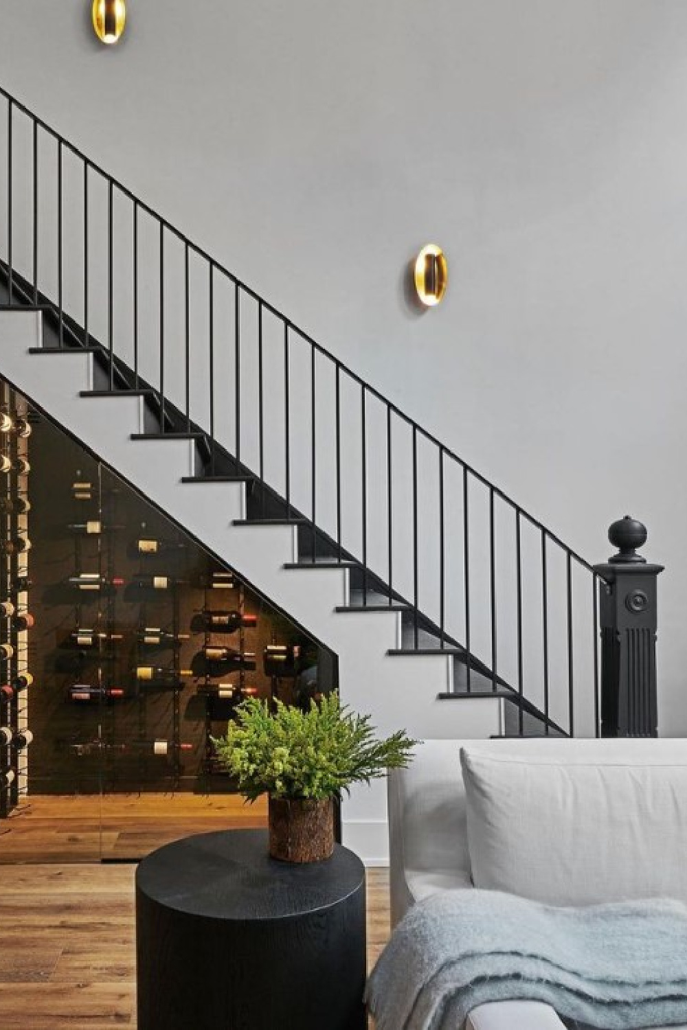 Wine storage room under staircase in a luxurious property designed by Alison Victoria of Windy City Rehab.