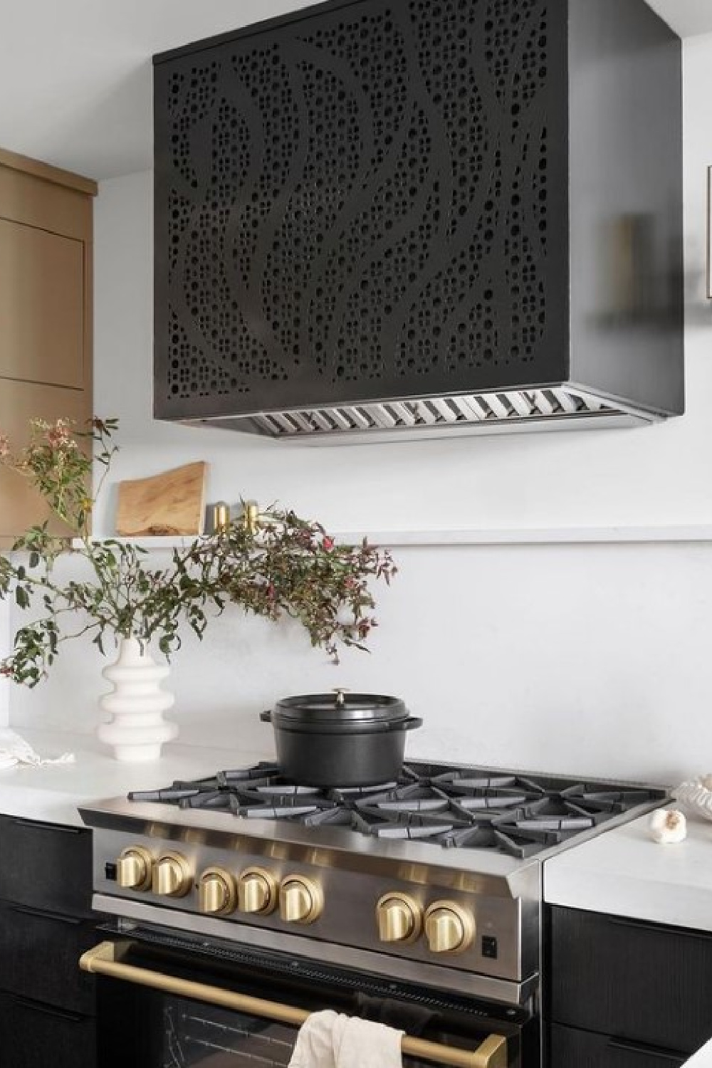 Luxurious black kitchen in beautiful Alison Victoria designed Atlanta loft on HTV's Windy City Rehab. Photo: Rustic White Interiors; Styling: Courtney Favini. House Beautiful.