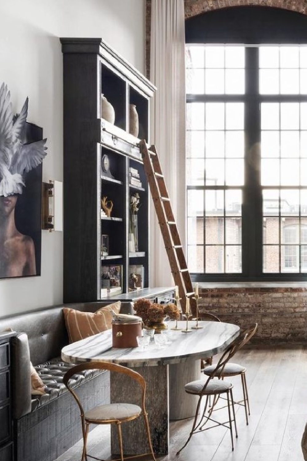 Banquette, built-ins and ladder in beautiful Alison Victoria designed Atlanta loft on HTV's Windy City Rehab. Photo: Rustic White Interiors; Styling: Courtney Favini. House Beautiful.