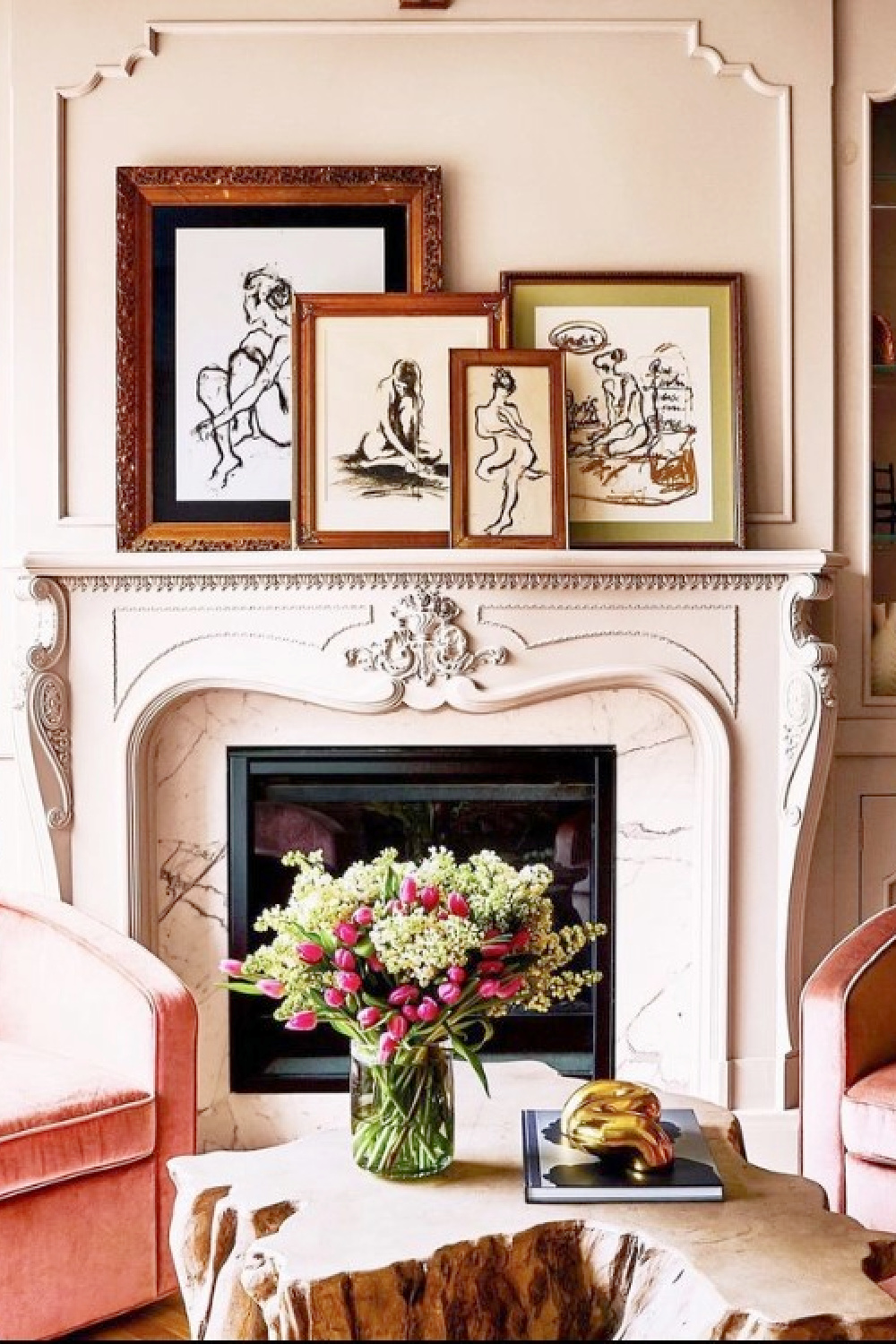 Antique French fireplace from Paris with artwork by Francine Turk in Alison Victoria's Chicago living room.