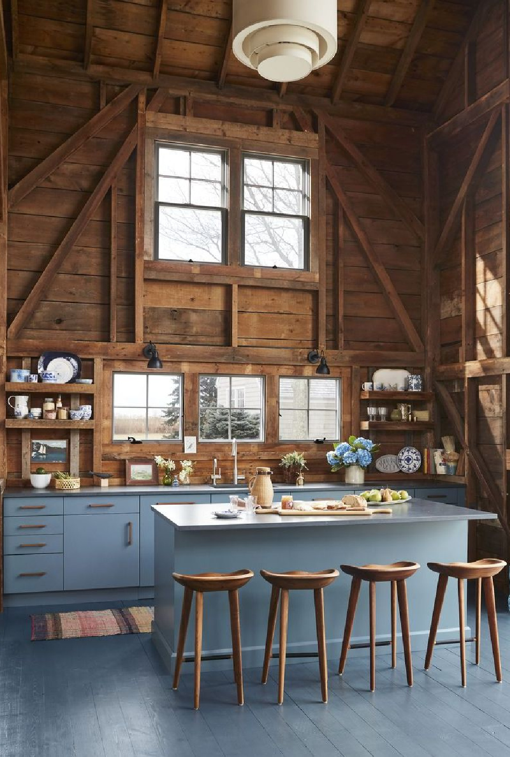 Rustic country blue kitchen (cabinets painted BM French Toile) designed by Hadley Wiggins (photo by David A. Land). #bluekitchens #rustickitchens