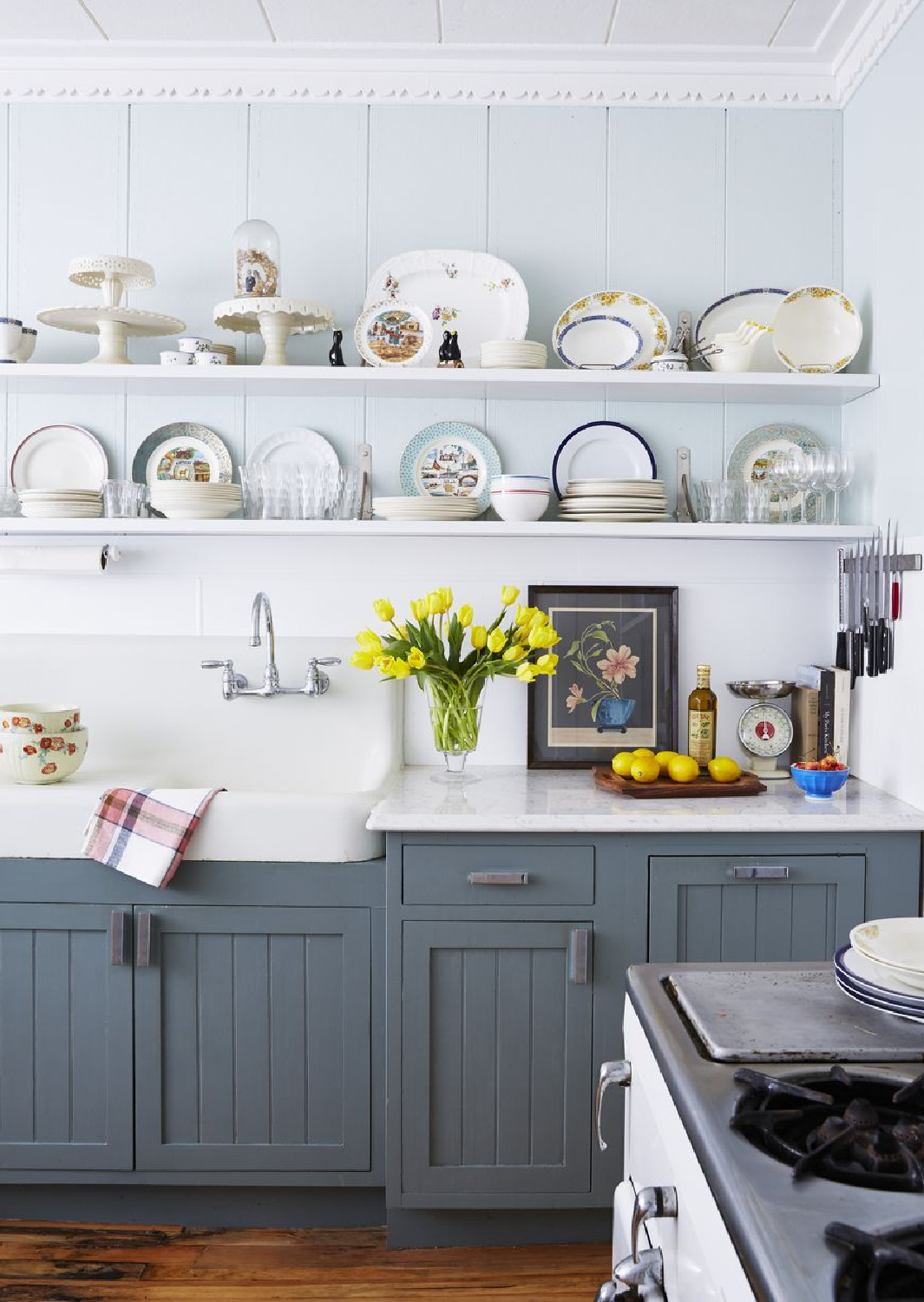 Night Train (Benjamin Moore) painted blue cabinets in a kitchen by Christina Salway (photo by Tara Donne). #benjaminmoorenighttrain #bluekitchens