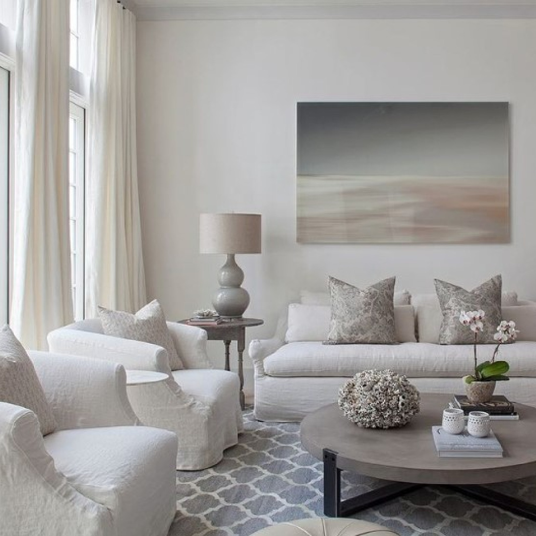 Luxurious living room (@alysbeachcontruction) with Venetian plaster walls and trim painted BM Decorator's White paint color. #decoratorswhite #bmdecoratorswhite